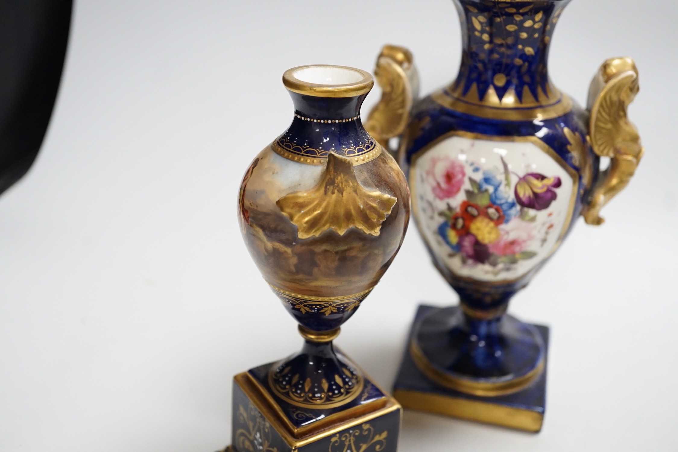 A two-handled pedestal Coalport vase, together with two other vases and a pair of posy vases. Tallest 22cm